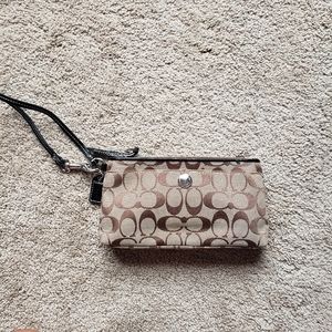 COACH Signature pattern wristlet